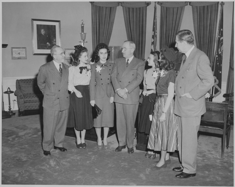 President Truman greets winners of the Voice of Democracy contest. L to R: Dr. John W. Studebaker, Janet Gerster, Rose Mudd, President Truman, Alice Tyree, Laura Shatta, and Sen. James Murray.