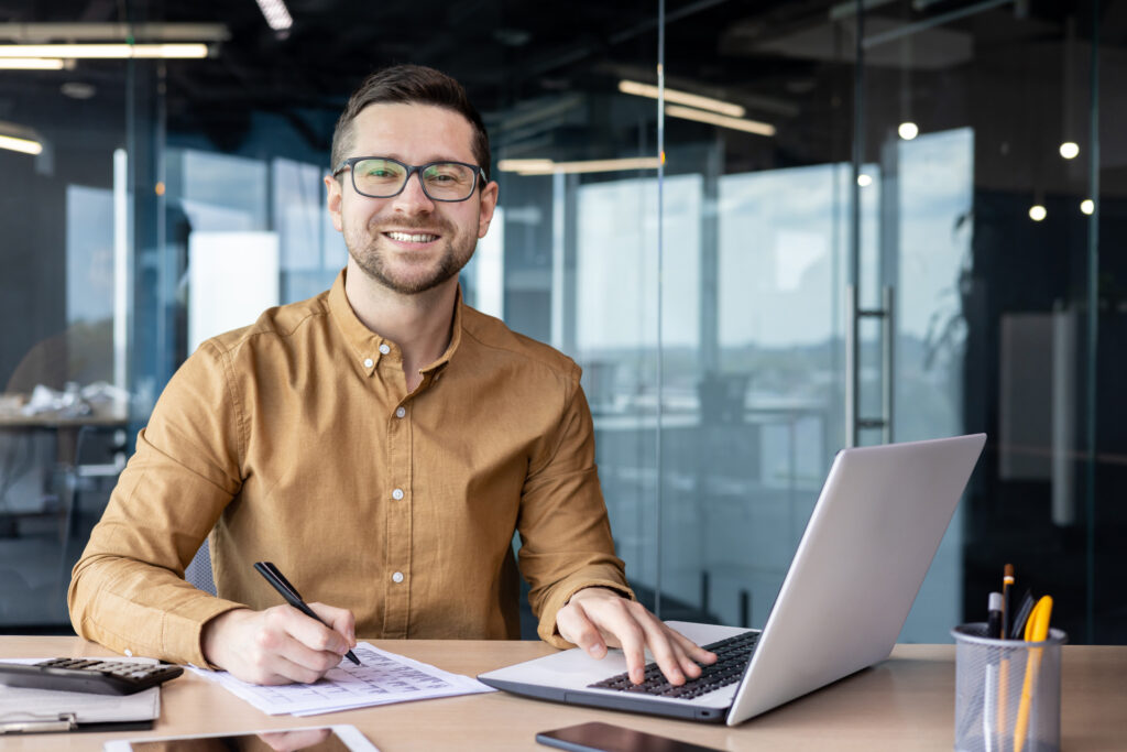 An executive assistant working on his computer